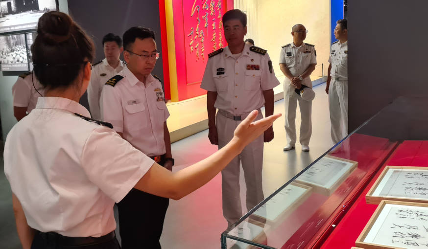 RADM Wat listening to the tour at the PLAN Naval Museum