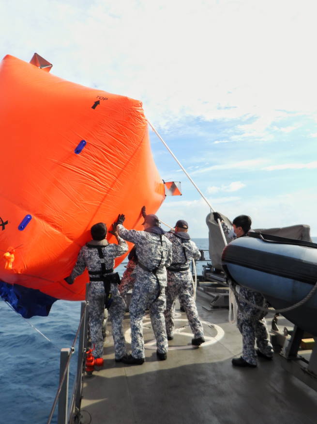 The crew preparing to launch the killer tomato target.