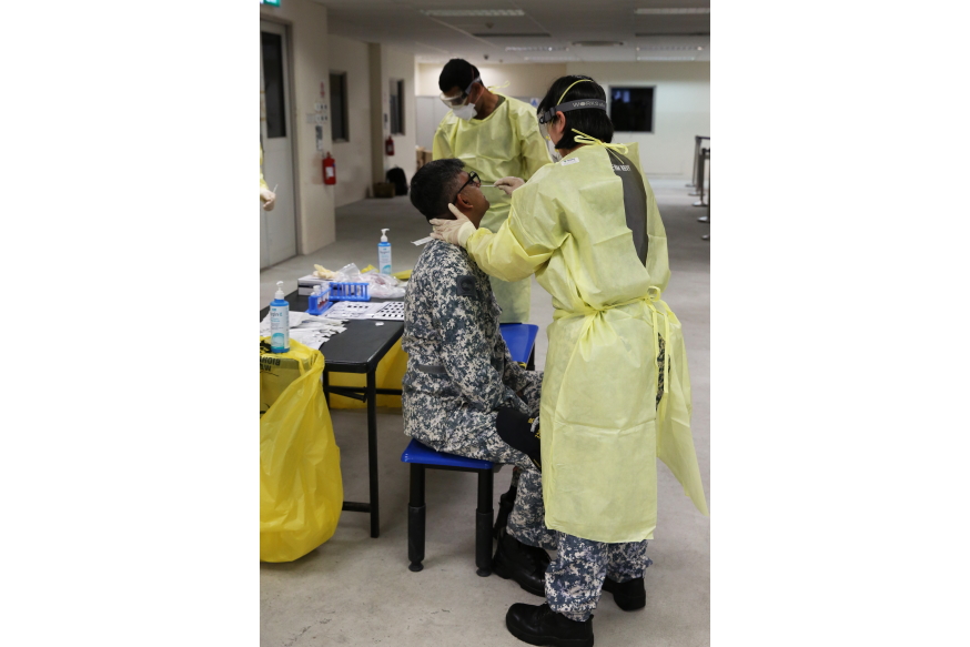 One of our NSmen having a nasopharyngeal swab performed on him to ensure that he is free from the COVID-19 virus.