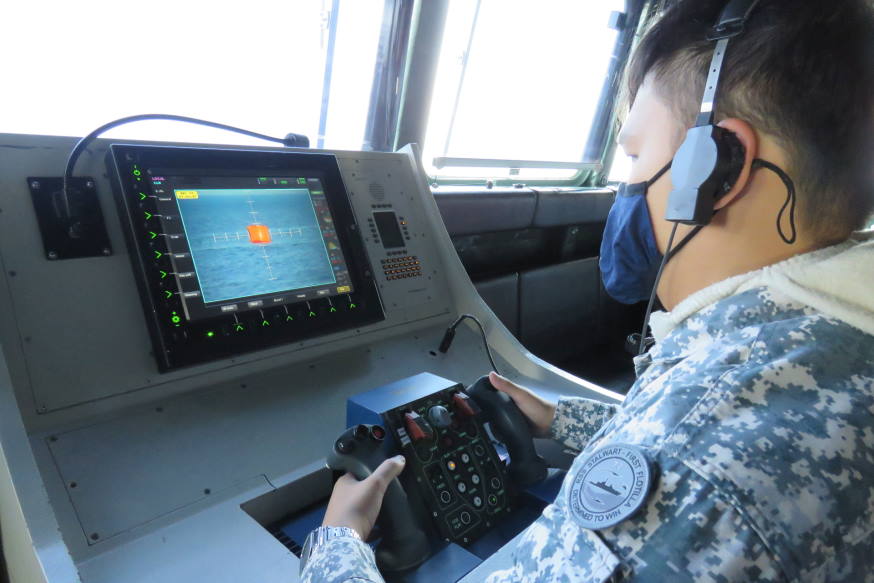 Our weapons systems operator with his eyes on the target during the gunnery firing.