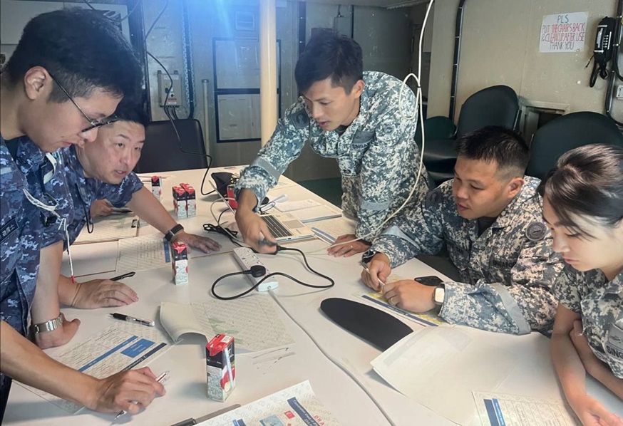 Whilst ashore in Yokosuka, Officers from RSS <em>Stalwart</em> (far right) and JS <em>Yūgiri</em> (far left) came together to plan the exercise serials.