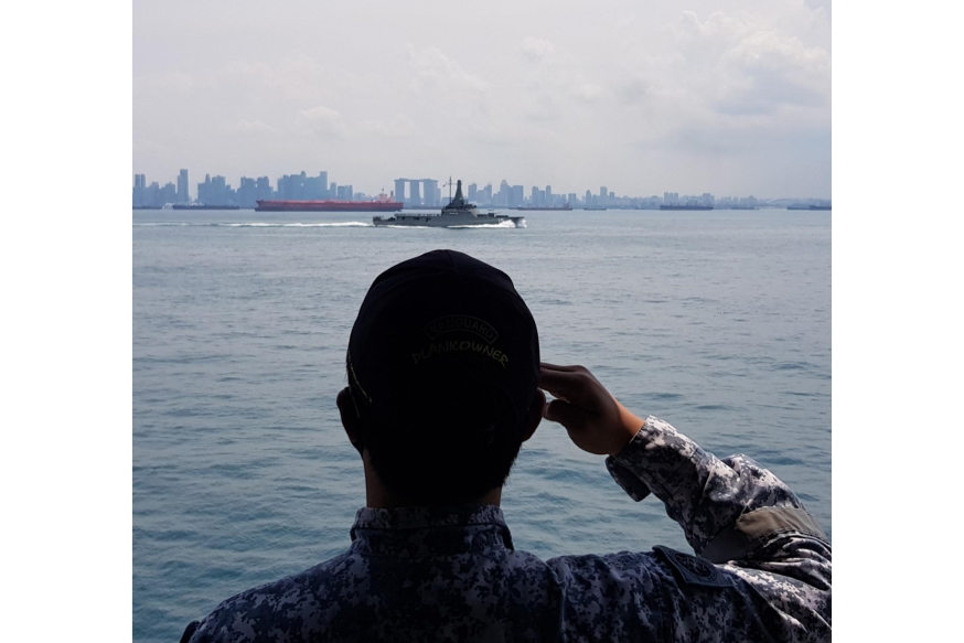 A ceremonial pipe at sea and salute to mark the changing over of watch between our ships.