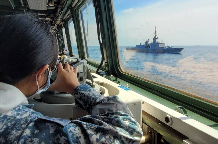 Crew of RSS Steadfast checking bearing during the manoeuvring exercise.